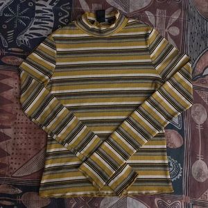 Yellow long sleeve turtle neck.